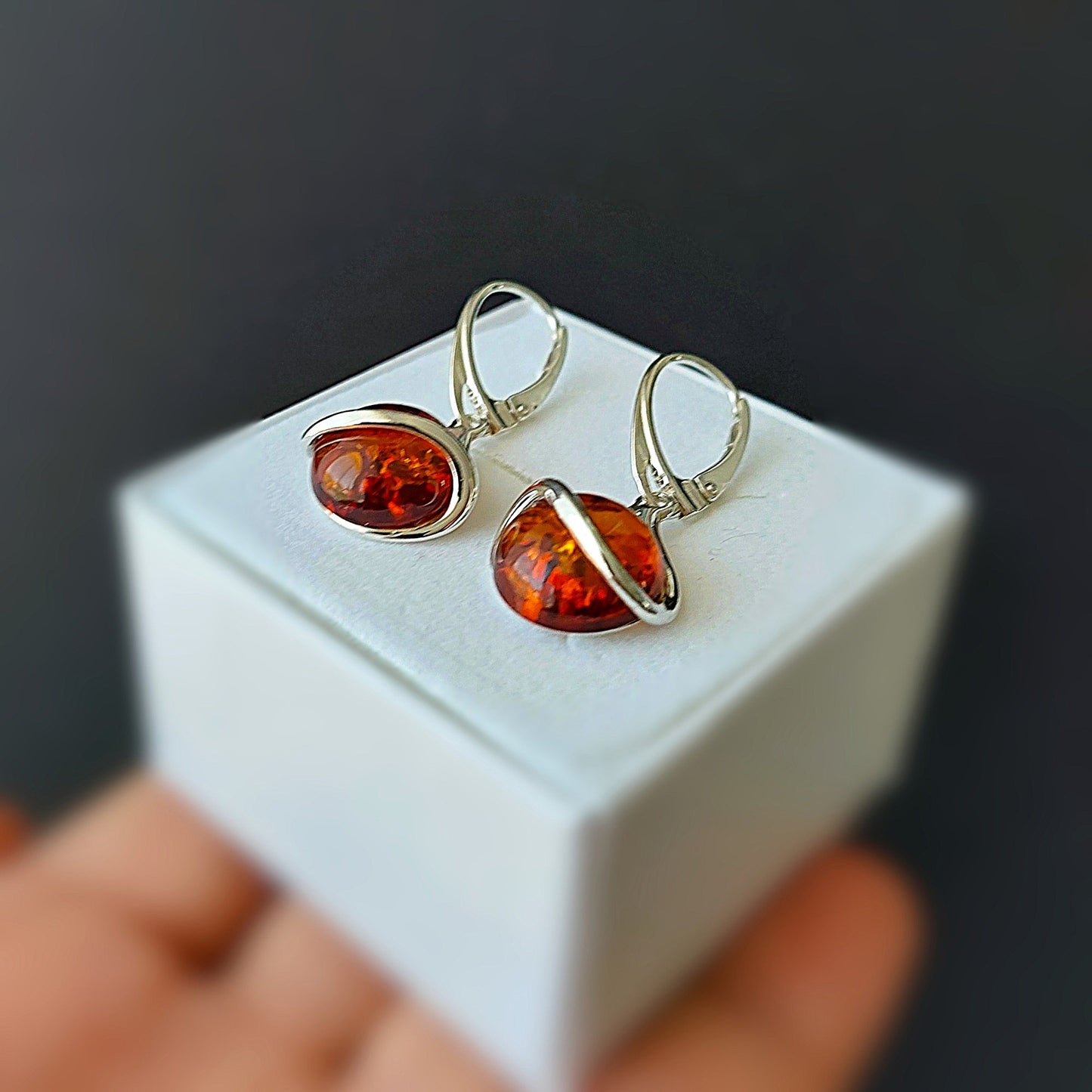 Sterling silver dangle earrings with round Baltic amber stones on English leverback hooks