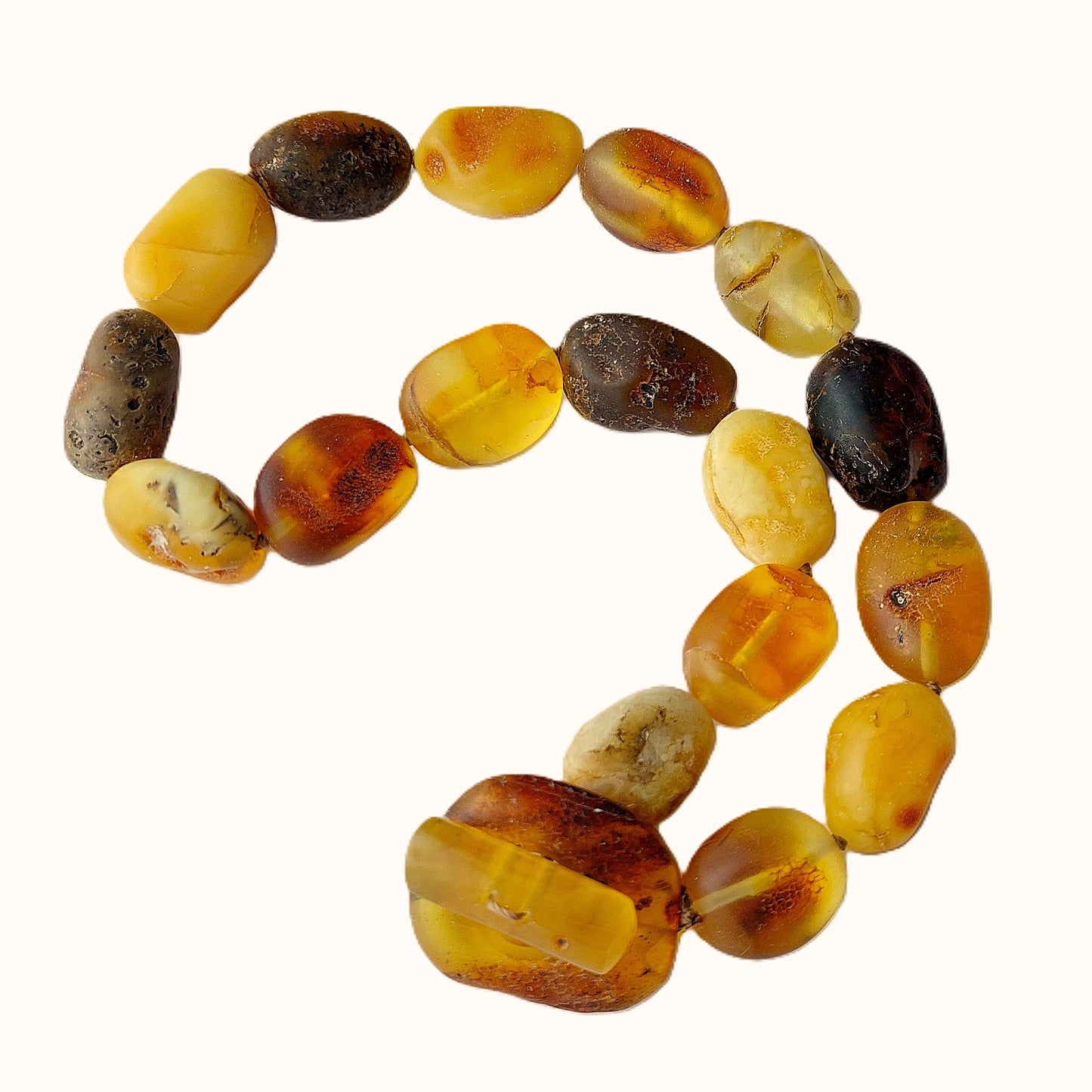Bracelet made of amber beads on a white background